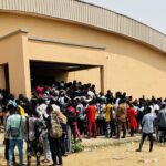 University of Ibadan DLC Students queueing up to write their CBT exams. 